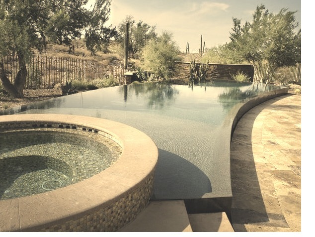 Picturesque southwest backyard with a custom-designed infinity hot tub
