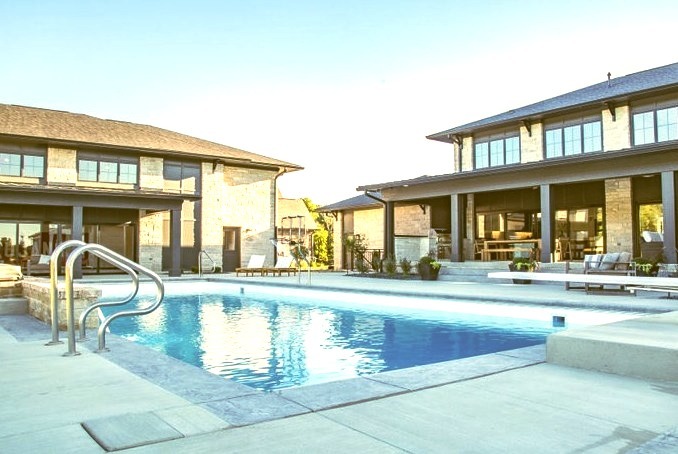 Huge backyard concrete and rectangular natural pool house photo