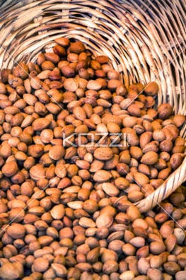 View Of A Wicker Basket Spilling A Bunch Of Almonds